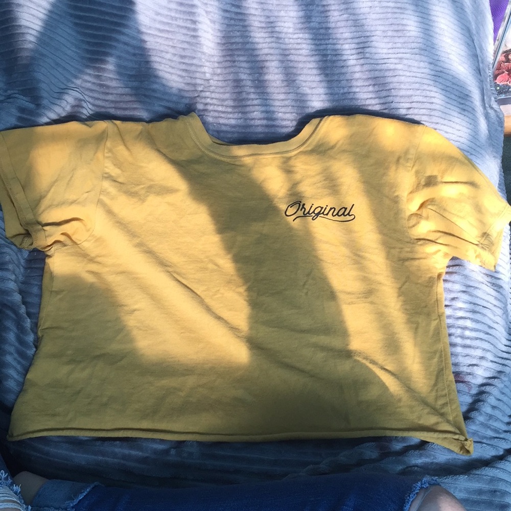 a yellow crop top that has the word original